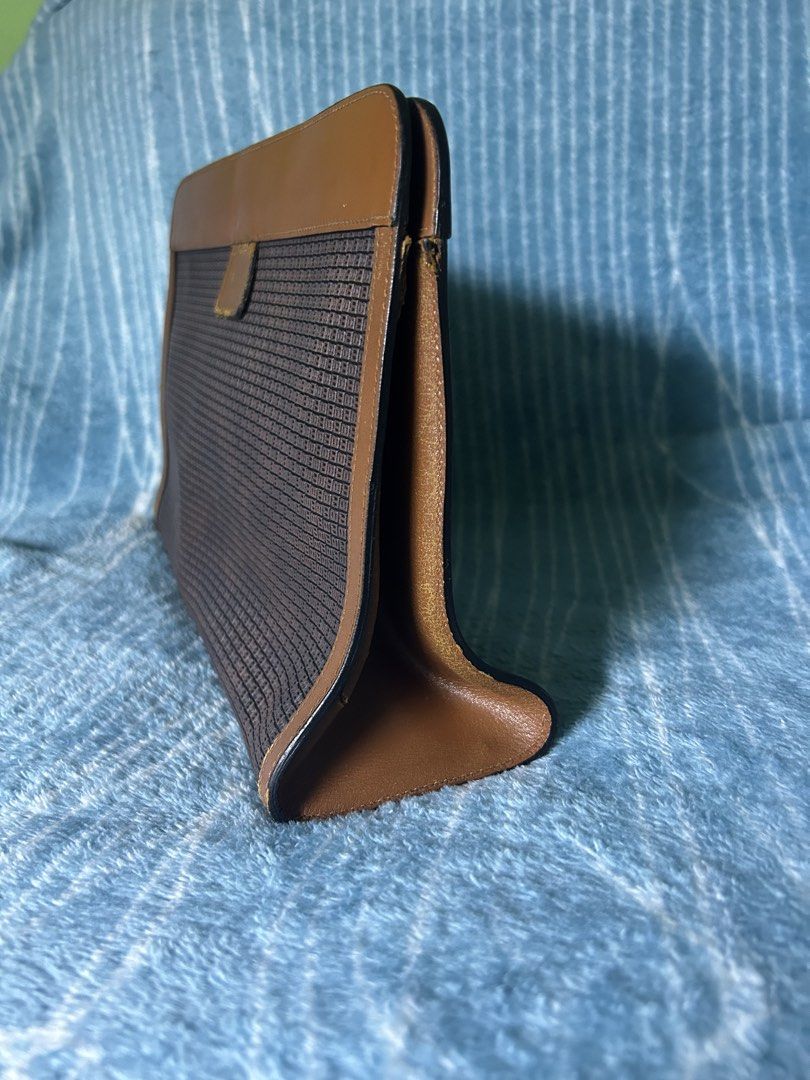 Vintage Bally Monogram Clutch Bag Brown (Category: Purses & Pouches) located in Quezon City. Submitted by thriftxgoods (Listing ID 1467891580, Image 3). Description: - Authentic vintage Bally clutch bag in classic brown monogram canvas - Features stylish leather trim and a subtle debossed 'B' logo on the front - Secure Velcro closure with expandable gusseted sides for extra space - Luxurious smooth tan leather interior with official Bally brand s