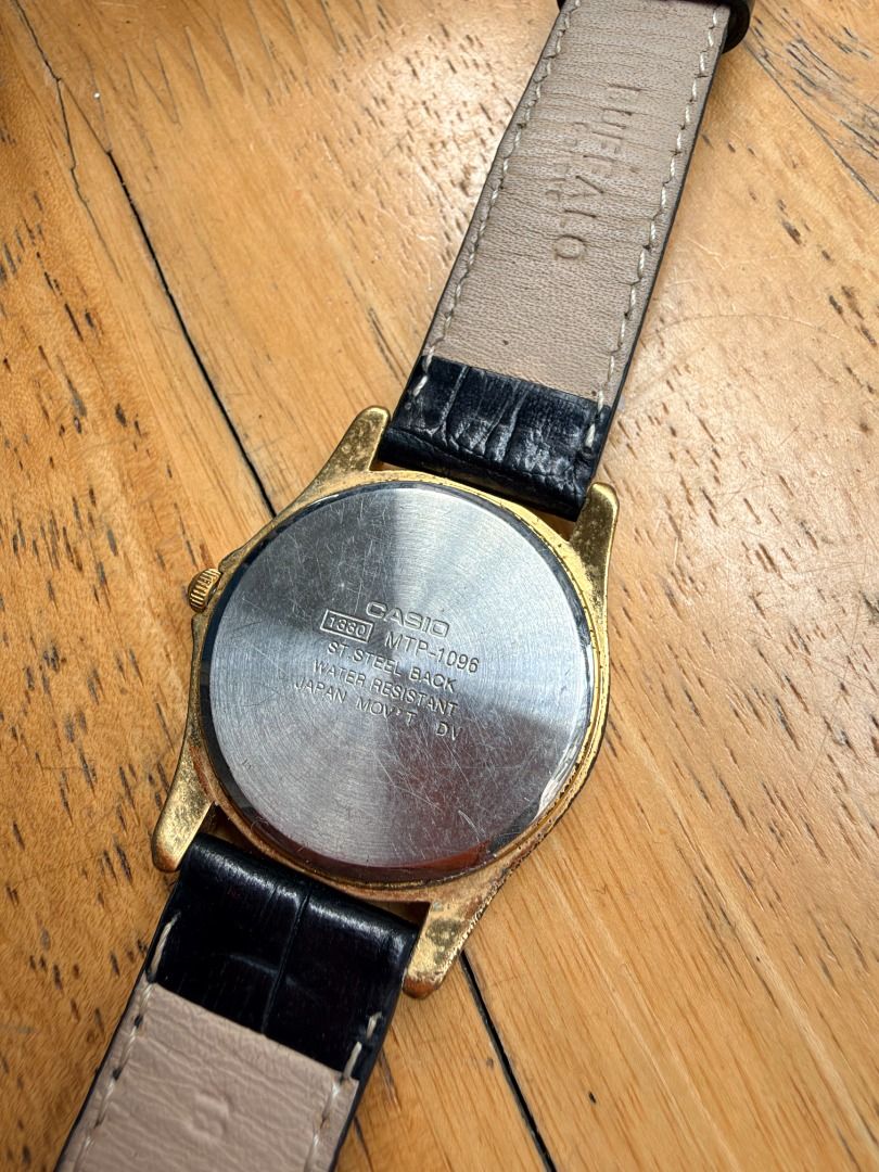 Vintage Casio Quartz Watch Gold Tone Silver Dial (Category: Women's Watches) located in Quezon City. Submitted by 30somethingtreasures (Listing ID 1467994555, Image 2). Description: - Brand: Casio - Movement: Quartz - Design: Gold-tone case with a sunburst silver dial - Strap: Black faux leather with croc-embossed texture and standard pin buckle - Features: Water resistant, gold hands and hour markers - Style: Classic dress watch, perfect for any