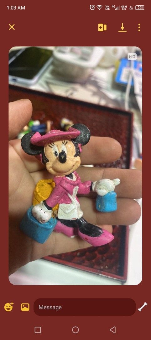 Vintage Mickey Mouse ceramic figurine reading a book (Category: Figurines & Statues) located in Angat. Submitted by reignsakura10 (Listing ID 1467847047, Image 1). Description: - Adorable ceramic Mickey Mouse figurine - Features Mickey in a red shirt, blue shorts, and yellow shoes while reading a green book - Finished with a vibrant glossy glaze - Hand-held collectible size, perfect for desks and shelves - Great gift for Disney fans and collector