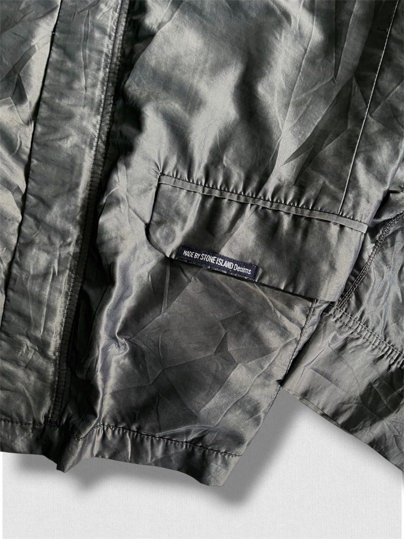 Vintage stone island jacket (Category: Hiking & Camping) located in Cebu City. Submitted by northdrip.threadd (Listing ID 1467905439, Image 2). Description: - Brand: Stone Island - Size: XL - Color: Dark Grey / Black - Style: Vintage utility jacket with multiple front pockets and epaulets - Interior: Classic houndstooth pattern lining - Condition: Well-preserved vintage piece with clear branding tags.