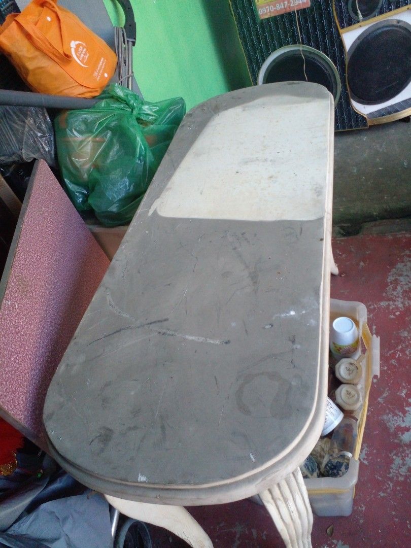 Vintage style coffee table with curved legs (Category: Tables & Sets) located in Quezon City. Submitted by madelrivera (Listing ID 1467998561, Image 2). Description: - Vintage wooden table with charming curved legs and fluted side details - Sturdy and solid build with an oval-shaped top - Shows significant surface wear, scratches, stains, and discoloration - Perfect DIY restoration project for sanding and repainting - Location: Pickup only.