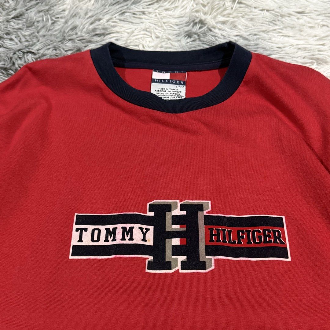Vintage Tommy Hilfiger Tee (Category: Tshirts & Polo Shirts ) located in Mandaluyong City. Submitted by iamkageki (Listing ID 1467947737, Image 2). Description: Sz S on tag fits M-L 21x29 Issue: minor bleed on logo.
