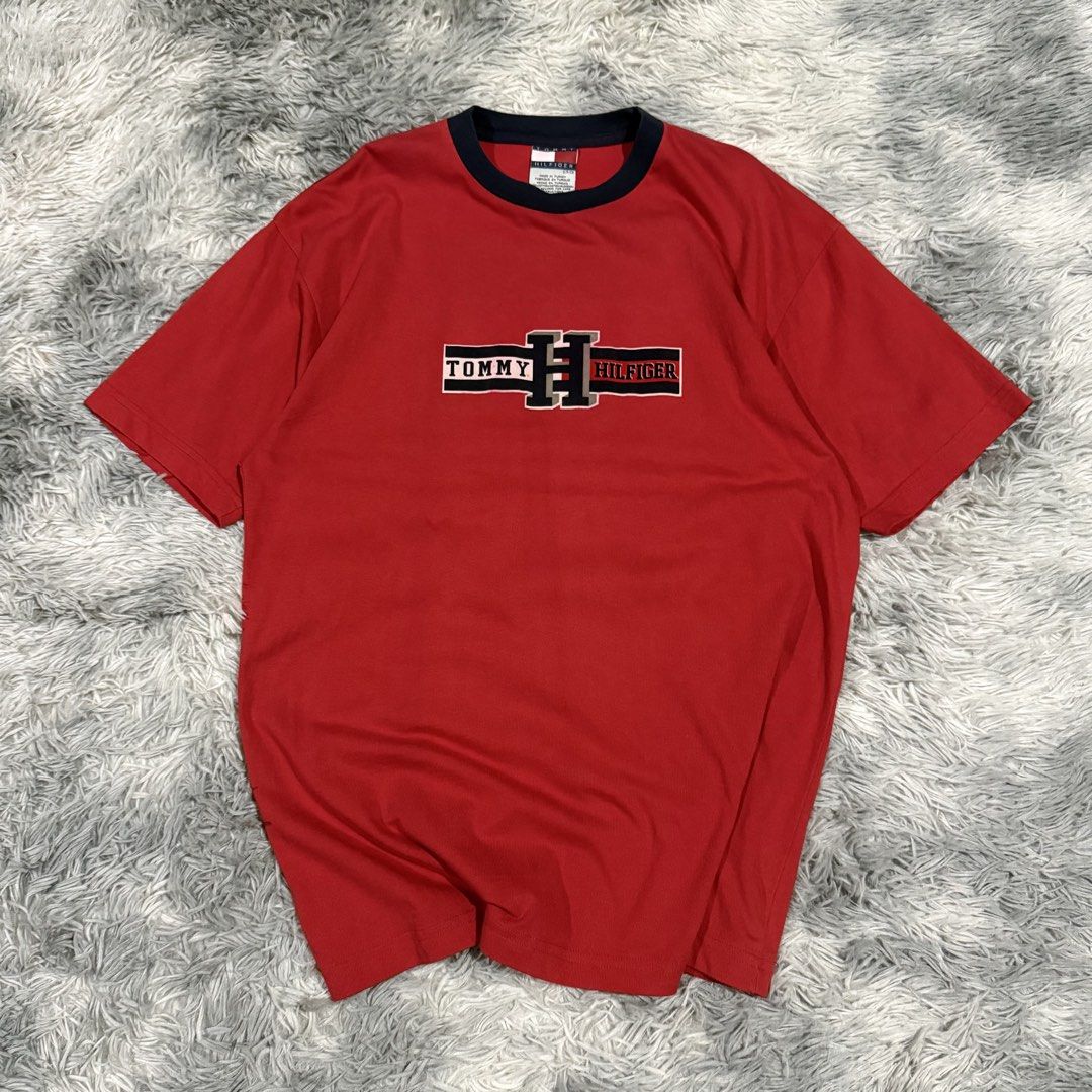 Vintage Tommy Hilfiger Tee (Category: Tshirts & Polo Shirts ) located in Mandaluyong City. Submitted by iamkageki (Listing ID 1467947737, Image 1). Description: Sz S on tag fits M-L 21x29 Issue: minor bleed on logo.
