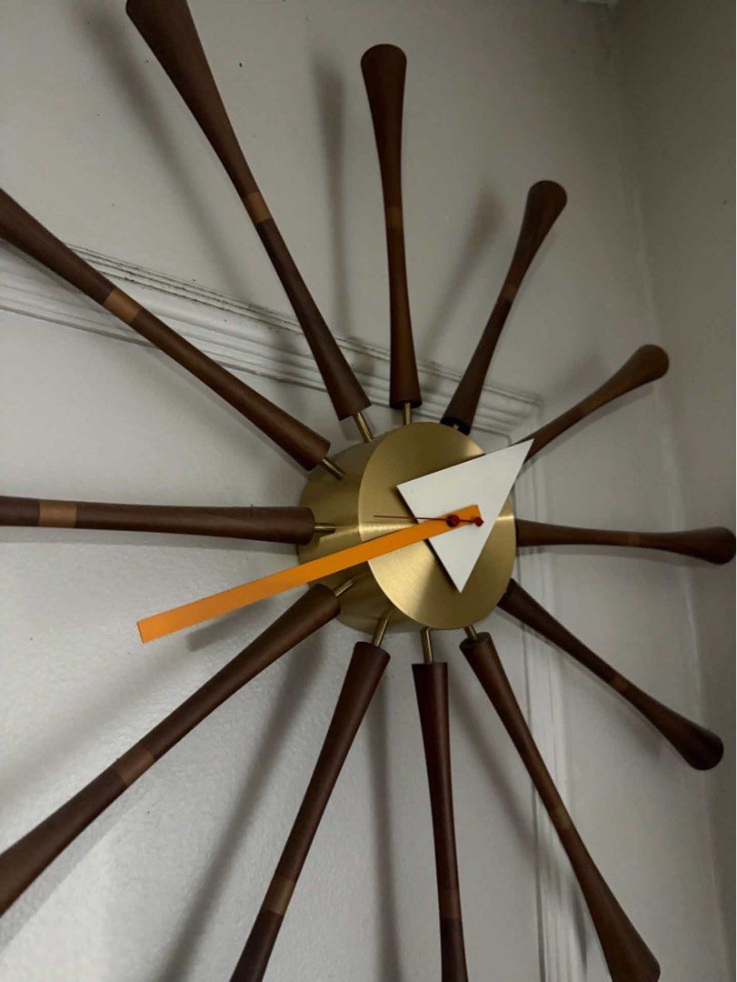 Authentic Vitra Spindle Clock by George Nelson – Excellent Condition (Category: Clocks) located in Mandaluyong City. Submitted by olachicoas (Listing ID 1467846776, Image 1). Description: Up for sale is an authentic Vitra Spindle Clock, designed by George Nelson. This iconic mid-century modern piece features turned solid walnut spindles, a brushed brass central hub, and signature geometric hands. It has been kept stored safely in the attic and re