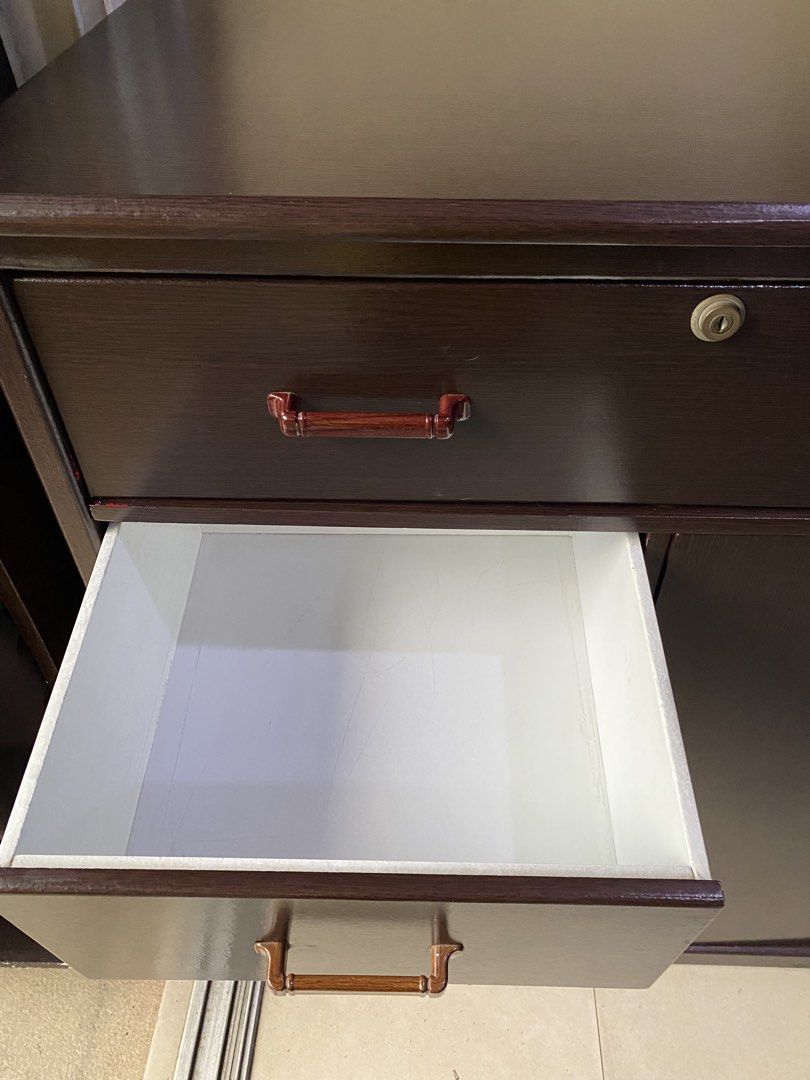 Wardrobe Cabinet with Drawers ( pre-loved) (Category: Shelves, Cabinets & Racks) located in Manila. Submitted by muqin_chimary (Listing ID 1467910836, Image 3). Description: Measurements : H110 x W86 x D44cm ✔️Wood grain ✔️ Multiple drawers for organized storage ✔️ Spacious cabinet compartment ✔️ Classic dark brown finish ✔️ Space-saving and practical design 📌 Pre-loved condition with some minimal signs of use. 💰 Price: ₱2,000 🚚 Buyer will sho