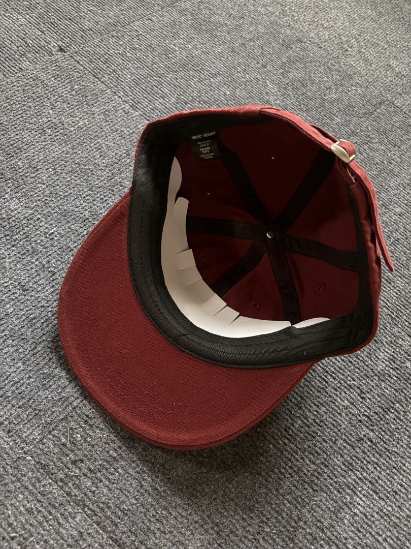 WASC House Collection Maroon Cap (Category: Caps & Hats) located in Manila. Submitted by toys_hats005 (Listing ID 1467956512, Image 3). Description: - Brand: WASC House Collection - Color: Maroon with white graphic print - Material: 100% cotton interior with a comfortable black sweatband - Fit: Adjustable strap closure with a silver-tone metal buckle - Condition: Clean fabric, shape retainer insert still inside.