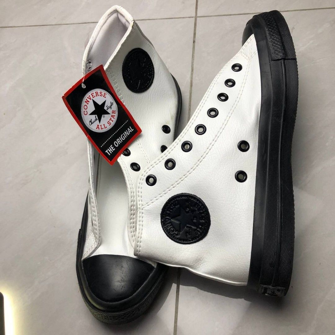 White & Black Leather High-Top Sneakers (Category: Casual Shoes) located in Cavite. Submitted by ace.hanro (Listing ID 1468043745, Image 3). Description: White & Black Leather High-Top Sneakers Price: ₱400 fix! Condition: Brand New with Tags (BNWT) Size: 46 Textured white leather design with black toe cap & sole Black eyelets & ankle patch detail Brand new and never worn, with original tag attached 📍 Pickup/Delivery / Lalamove / J&T 📩 PM for qu
