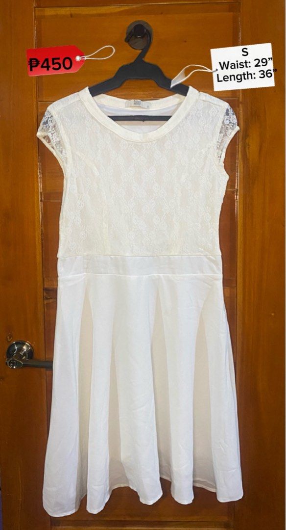 White Lace Dress Size S (Category: Dresses) located in Baguio. Submitted by heath2600 (Listing ID 1468029928, Image 1). Description: - Size: Small - Color: Solid White - Design: Lace top with short cap sleeves, round neckline, and a flared skirt - Measurements: Waist 29 inches | Length 36 inches - Condition: Clean and ready to wear.