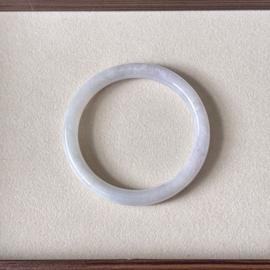 White Moonlight Lavender Type A Jadeite Jade Bangle 52.7mm (Category: Bracelets) located in Pasig City. Submitted by bleuvelyatelier (Listing ID 1467938955, Image 1). Description: -Authentic Burmese Jadeite -Type A -Moonlight white base and very faint lavender color -Glutinous texture -Slim full round style -inner diameter: 52.7mm -width:7mm -This bangle has natural stone line -comes with certificate Payment via GCash or Bank Transfer.