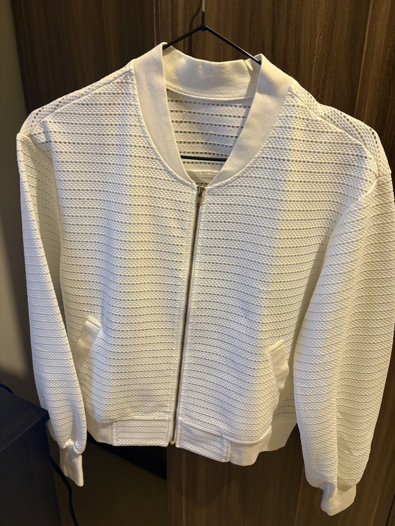 White textured mesh zip-up bomber jacket (Category: Coats, Jackets and Outerwear) located in Manila. Submitted by loislane112233 (Listing ID 1467987625, Image 1). Description: - Color: White - Material: Lightweight, slightly sheer textured mesh fabric - Closure: Full front gold zipper - Details: Ribbed collar, cuffs, and hem with two front slant pockets - Style: Clean and easy to throw over basic tees.
