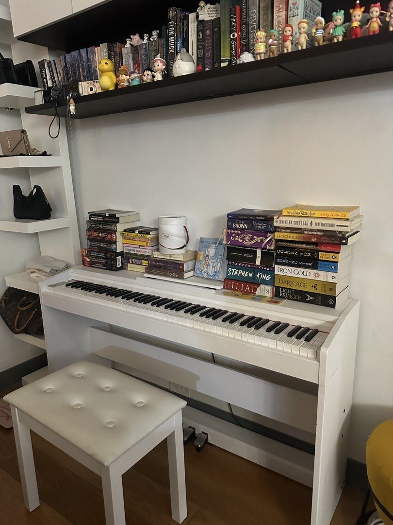 White Upright Electric Piano with Stool (Category: Musical Instruments) located in Makati City. Submitted by bubby.studio (Listing ID 1467903637, Image 1). Description: rfs: not being used. perfectly working. no flaws. last price posted!.
