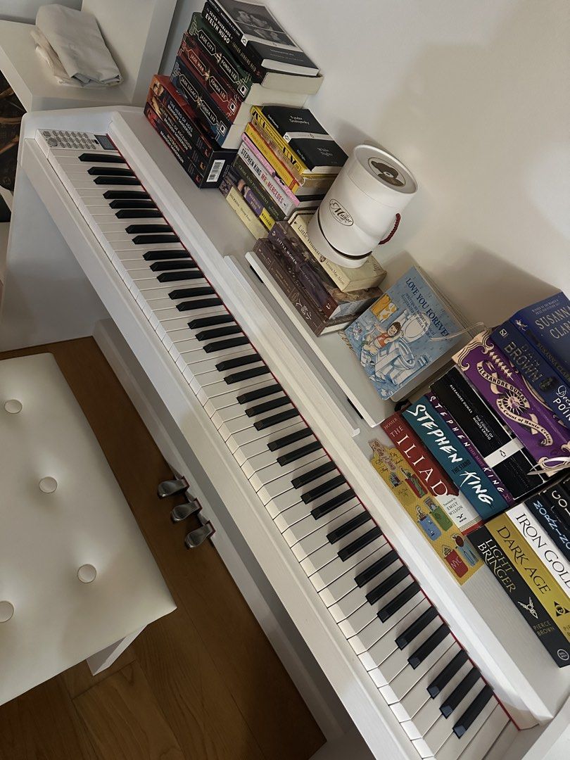 White Upright Electric Piano with Stool (Category: Musical Instruments) located in Makati City. Submitted by bubby.studio (Listing ID 1467903637, Image 2). Description: rfs: not being used. perfectly working. no flaws. last price posted!.