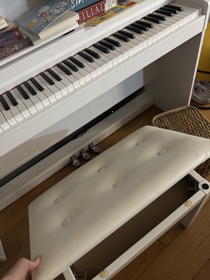 White Upright Electric Piano with Stool (Category: Musical Instruments) located in Makati City. Submitted by bubby.studio (Listing ID 1467903637, Image 3). Description: rfs: not being used. perfectly working. no flaws. last price posted!.