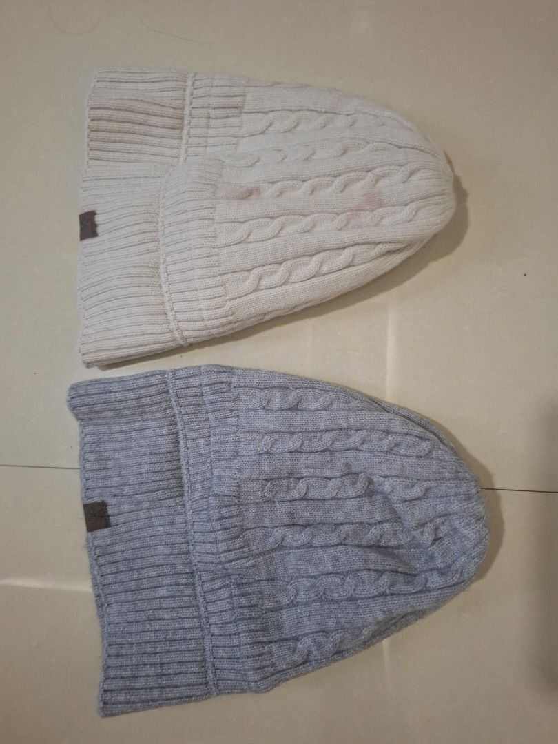 Winter Knit Beanies Set Grey and White (Category: Hats & Beanies) located in Imus. Submitted by maggieforce (Listing ID 1467869642, Image 1). Description: -personal preloved - Set of 2 chunky cable knit beanies: 1 grey and 1 off-white - Features a cozy ribbed cuff and a stylish brown leather-look front patch - Thick and warm material, perfect for cold weather - Selling as a bundle - Flaw: The off-white beanie has noticeable reddish stains near th