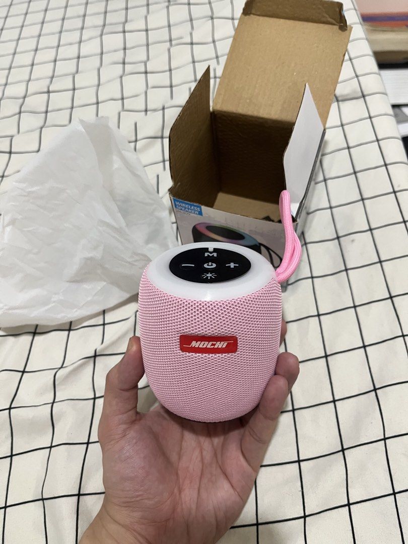 Wireless Bluetooth Speakers Pink (Category: Soundbars, Speakers & Amplifiers) located in Quezon City. Submitted by tradingcardsandmore (Listing ID 1467843372, Image 2). Description: - Model: Mochi SH-309 Wireless Speaker - Color: Cute Pink - Design: Compact and portable with a convenient carrying strap and top control buttons - Lighting: Fun LED lighting effect around the top rim - Condition: Clean inside and out - Inclusions: Original box and ch