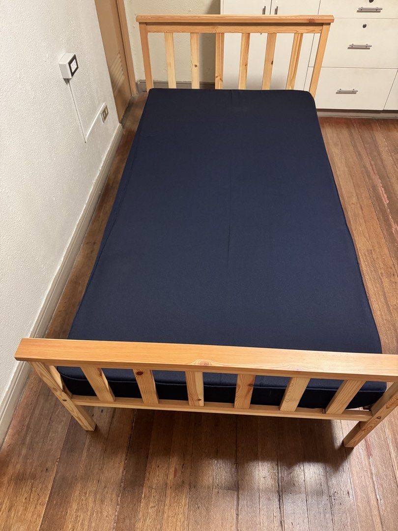 Wooden Single Bed Frame with Mattress (Category: Bed Frames & Mattresses) located in Makati City. Submitted by avic_c (Listing ID 1465179775, Image 2). Description: Available when not yet marked SOLD. Wooden single bed frame purchased from The Landmark Makati, with mattress included. Sturdy natural-wood frame with headboard, wooden slats and center support. In good used condition. Mattress has been kept covered and is also included in the price. 