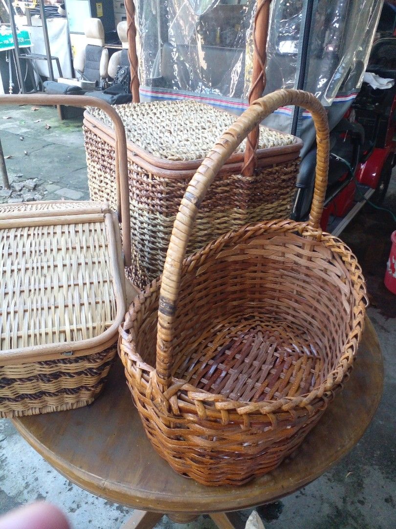 Woven wicker storage basket with handle and lid (Category: Storage Boxes & Baskets) located in Quezon City. Submitted by madelrivera (Listing ID 1467995903, Image 2). Description: Handcrafted woven baskets in natural brown and tan shades. Includes lidded picnic style basket and round handled basket. Great for storage, organization, or decor around the house. Natural materials tightly woven for durability. Sturdy handles and closures. 3pcs take al