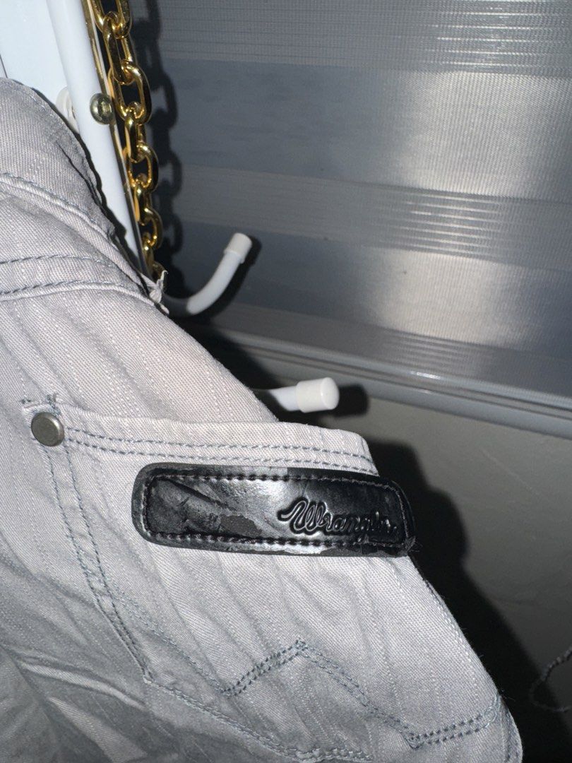 Wrangler Grey Denim Jeans Size W32 (Category: Jeans) located in La Trinidad. Submitted by prelovedandfindsbyji (Listing ID 1467929397, Image 2). Description: - Brand/Style: Wrangler Tina - Size: W32 - Color: Grey - Material: 98% cotton, 2% elastane blend for a comfortable stretch - Fit: Standard waist - Features: Iconic Wrangler back pocket stitching and sturdy fabric construction - Condition Note: Black leather brand patch near the waistband has