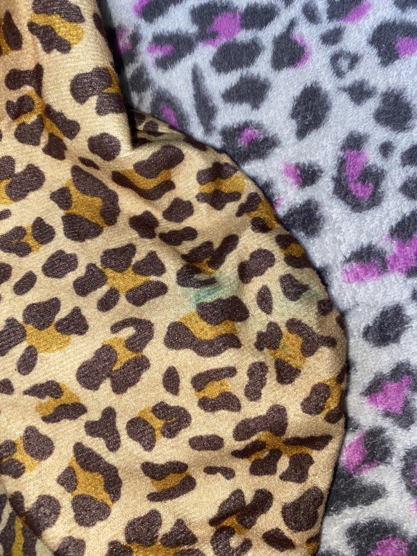 X-Girl Leopard Print Boston Bag (Category: Tote Bags) located in Calamba. Submitted by 3n.rique (Listing ID 1467924407, Image 2). Description: - Brand: X-Girl - Design: Fuzzy leopard print with brown fabric handles and front brand patch - Features: Roomy interior, ideal for daily essentials - Condition: Great everyday shoulder bag with a small greenish stain near the bottom corner.