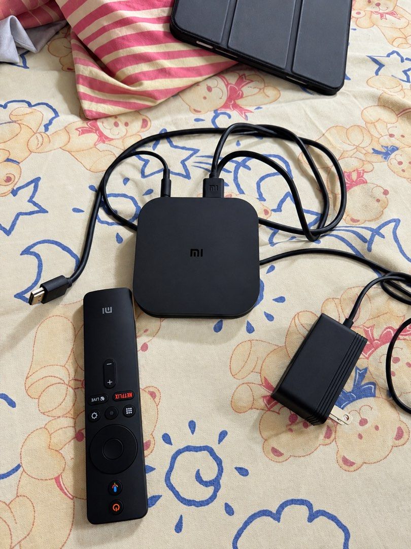 Xiaomi Mi TV Box with Remote and Cables (Category: TV Parts & Accessories) located in San Pedro. Submitted by chenramirez (Listing ID 1467907964, Image 1). Description: - Xiaomi TV box in fully functional, tested condition - Includes original remote, power adapter, and HDMI cable - Smooth streaming for Netflix, YouTube, and other apps - Quick and easy setup on any HDMI-compatible TV - Great way to ditch cable and stream instantly.