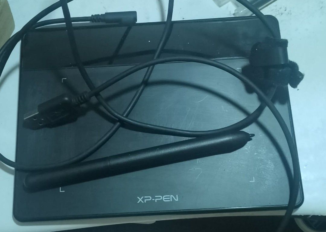 XP-Pen Deco Fun XS Pen Tablet (Category: Stationery & School Supplies) located in Manila. Submitted by lorenzolou30738 (Listing ID 1467931916, Image 2). Description: - Model: XP-Pen Deco Fun XS - Color: Black - Condition: Used with minor surface scratches; fully working - Inclusions: Stylus pen and USB connection cable - Features: Compact size, perfect for digital art, sketching, and online classes - Status: Ready for immediate use.