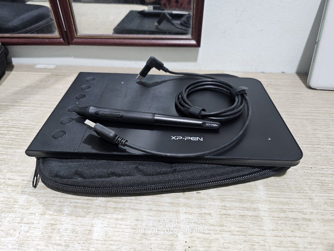 XP-Pen Drawing Tablet with Stylus and Cable (Category: Other Gadgets) located in Dasmarinas. Submitted by jazvielle (Listing ID 1467910131, Image 2). Description: - Complete XP-Pen graphic tablet bundle in black - Includes drawing pad, branded stylus pen, and velcro-secured coiled USB cable - Surface shows minimal signs of handling - Fully tested and working properly - Ideal setup for digital artists, students, and graphic designers 👉 Honest dis