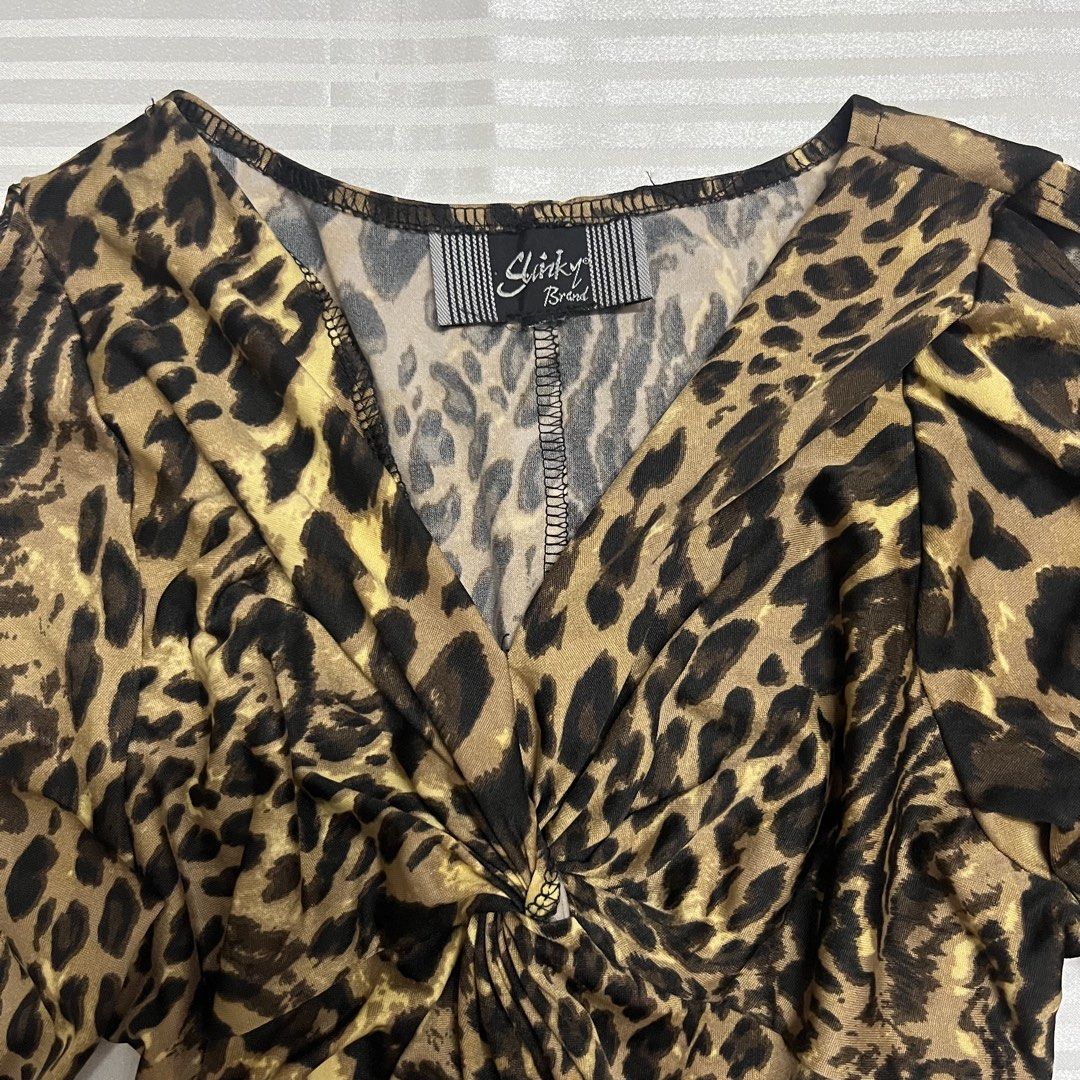 Y2K Leopard Print Twist Front Midi Dress (Category: Dresses) located in Manila. Submitted by ave.archives (Listing ID 1467980126, Image 3). Description: Condition: 10/10 Size: S-M Fabric is stretchable.