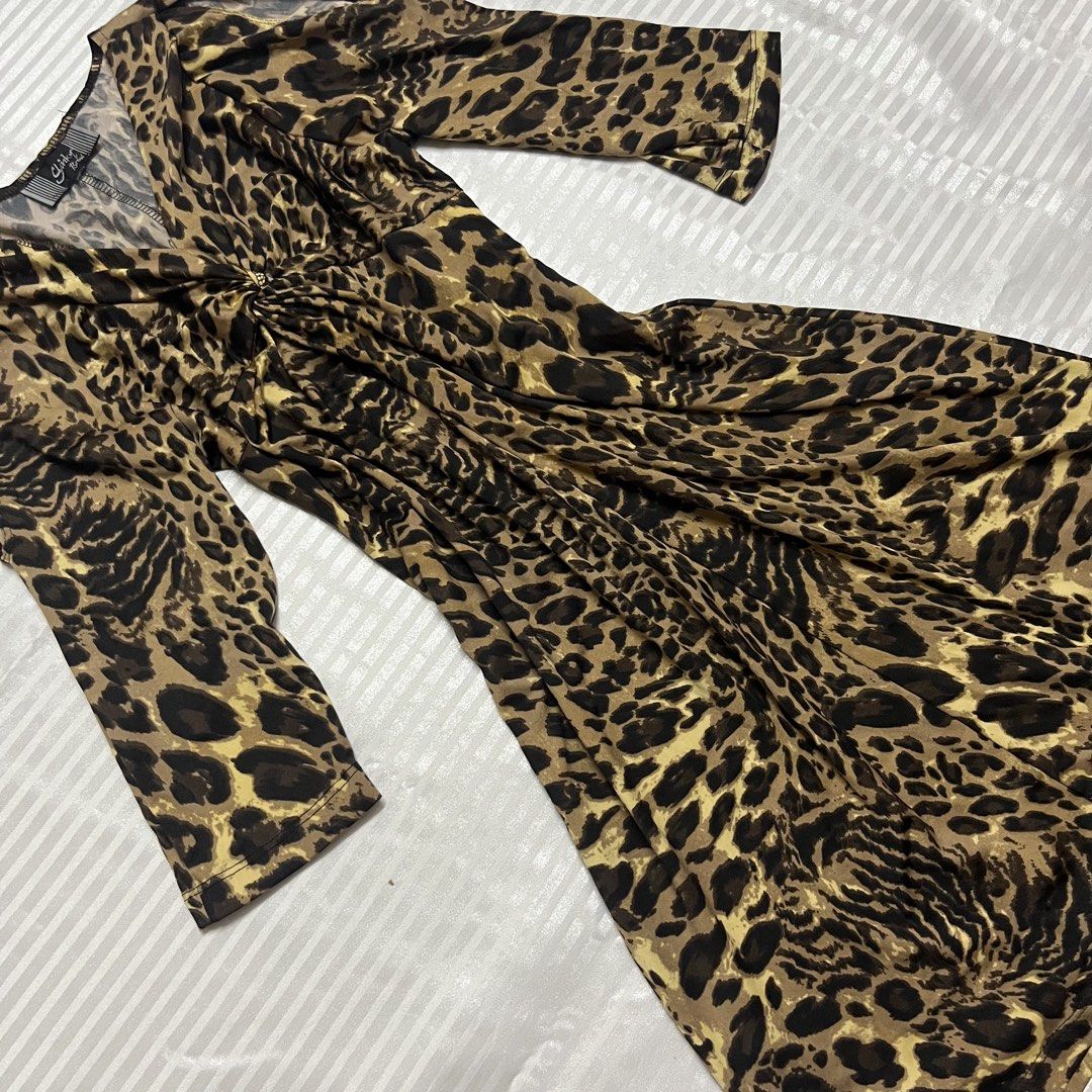 Y2K Leopard Print Twist Front Midi Dress (Category: Dresses) located in Manila. Submitted by ave.archives (Listing ID 1467980126, Image 2). Description: Condition: 10/10 Size: S-M Fabric is stretchable.