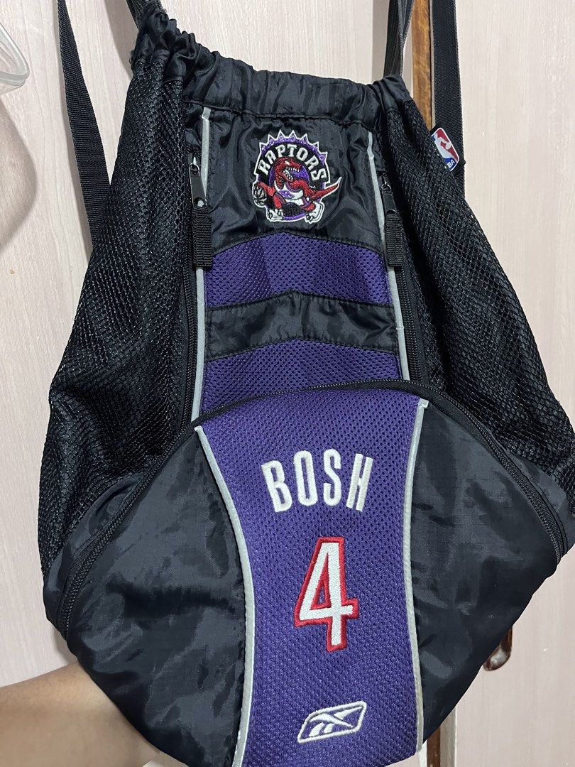 Y2k Vintage NBA Reebook Bosh backpack |free shipping (Category: Backpacks) located in Iloilo. Submitted by youronlinesister (Listing ID 1455532898, Image 3). Description: This is a vintage mid-2000s Reebok-era player-themed sling backpack from Chris Bosh’s tenure with the team (2003–2010), featuring the iconic retro purple dinosour emblem. VINTAGE NBA RAPTORS REEBOK BOSH 4 PRELOVE Maganda pa *Medyo Faded ang straps *May signs of use sa reflectori