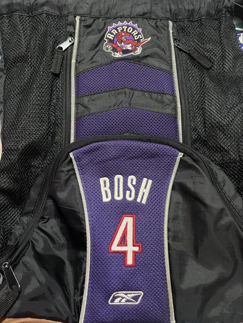 Y2k Vintage NBA Reebook Bosh backpack |free shipping (Category: Backpacks) located in Iloilo. Submitted by youronlinesister (Listing ID 1455532898, Image 2). Description: This is a vintage mid-2000s Reebok-era player-themed sling backpack from Chris Bosh’s tenure with the team (2003–2010), featuring the iconic retro purple dinosour emblem. VINTAGE NBA RAPTORS REEBOK BOSH 4 PRELOVE Maganda pa *Medyo Faded ang straps *May signs of use sa reflectori