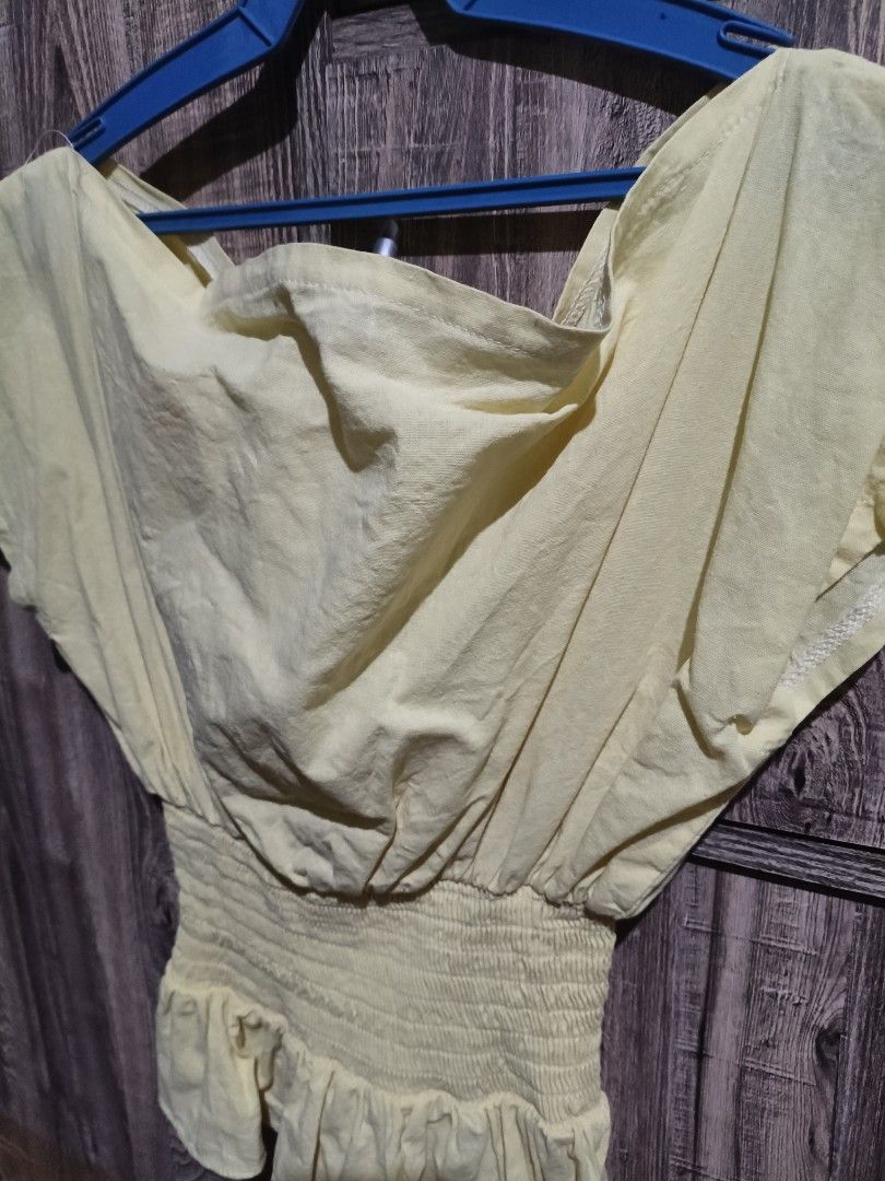 Yellow off-shoulder smocked waist top (Category: Blouses) located in Manila. Submitted by vivi.goodies (Listing ID 1468029615, Image 2). Description: .