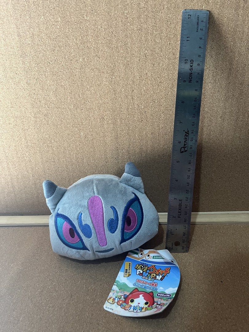 Yo-kai Watch Puni Puni Plush Toy (Category: Plushies & Soft Toys) located in Baguio. Submitted by gaara1234 (Listing ID 1467857657, Image 1). Description: - Authentic Yo-kai Watch Puni Puni gray plush toy - Features detailed embroidered eyes and accents - Compact size: approximately 4 inches wide - Original tag still attached at the bottom - Perfect for collectors and fans.