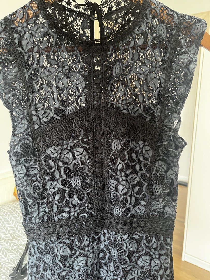 Zara Basic Black Lace Dress Size S (Category: Dresses) located in Manila. Submitted by lorenasant37621 (Listing ID 1467854976, Image 3). Description: - Brand: Zara Basic - Style: Black lace midi dress with mock neck and cap sleeves - Details: Intricate floral lace pattern, defined waistline with trim, and back button closure - Size: S (fits true to size) - Occasion: Ideal for dinners and evening events - Condition: Excellent.