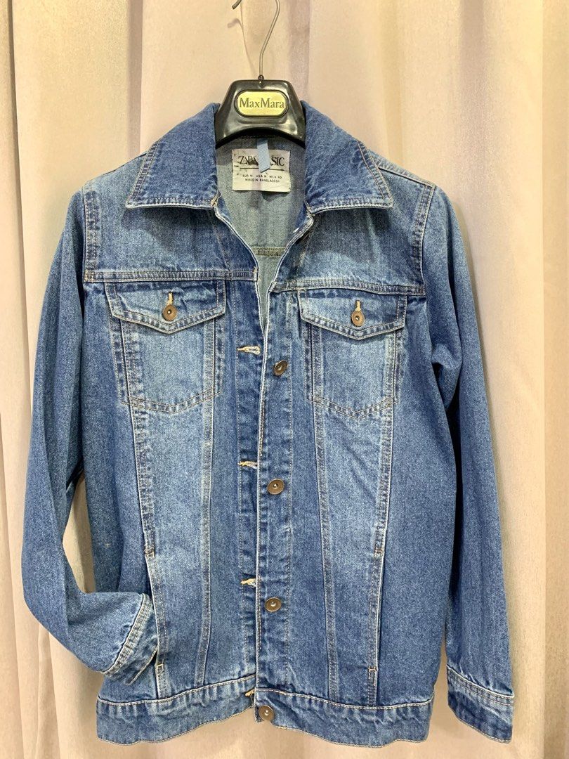Zara Basic Blue Denim Jacket Size M (Category: Coats, Jackets and Outerwear) located in Pasig City. Submitted by angelamendozaaa (Listing ID 1467952109, Image 1). Description: Classic Zara Basic denim jacket in medium blue wash. A versatile everyday outerwear piece with a structured collar, button closure, and dual chest pockets. Sturdy and easy to style with any outfit. Med on tag, B20 Sh16 L26 in excellent condition declutterring Sf c/o buyer p