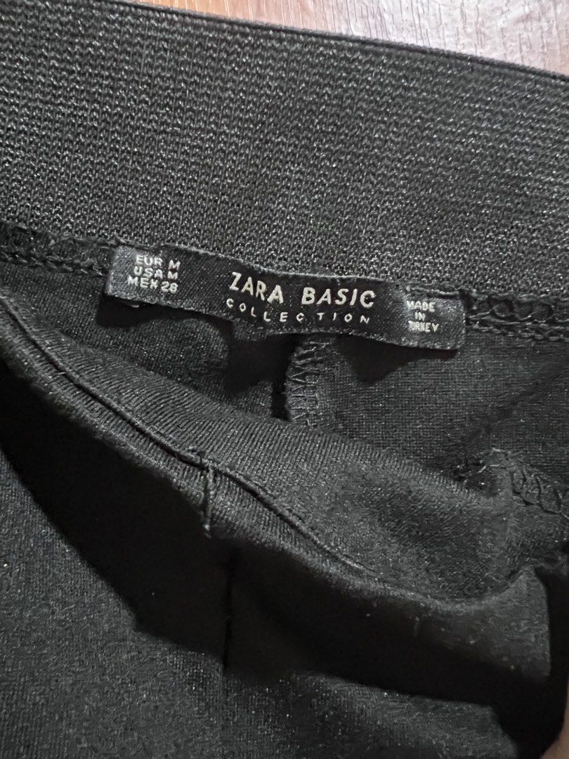 Zara Basic Collection Black Pants Size M (Category: Jeans) located in Manila. Submitted by wardrobeinmnl (Listing ID 1467878976, Image 2). Description: - Brand: Zara Basic Collection - Size: Medium (EUR M, USA M, MEX 28) - Color: Classic Black - Origin: Made in Turkey - Style: Comfortable pull-on pants with elastic waistband - Details: Trendy ribbed side panels and decorative gold-tone buttons on the front sides.