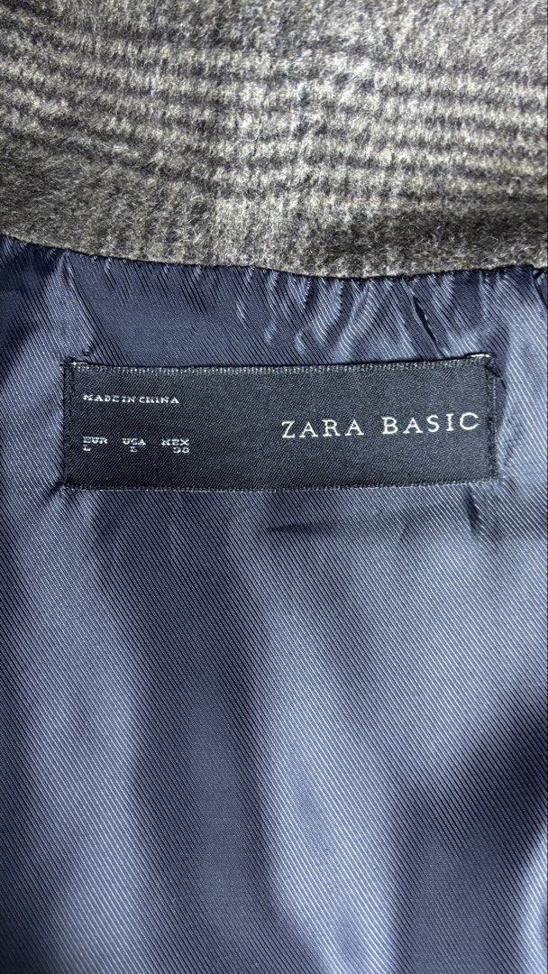 Zara Basic Grey Plaid Hooded Coat Size L (Category: Coats, Jackets and Outerwear) located in Bacoor. Submitted by calvinmanzano13 (Listing ID 1468056280, Image 3). Description: - L = 27” | W = 24” - Style: Hooded coat in classic grey plaid - Material: 51% polyester, 40% wool, 6% acrylic, 3% nylon; 100% polyester lining - Condition: Clean inside and out, excellent pre-loved condition - Features: Comfortable attached hood and smooth dark inner lini