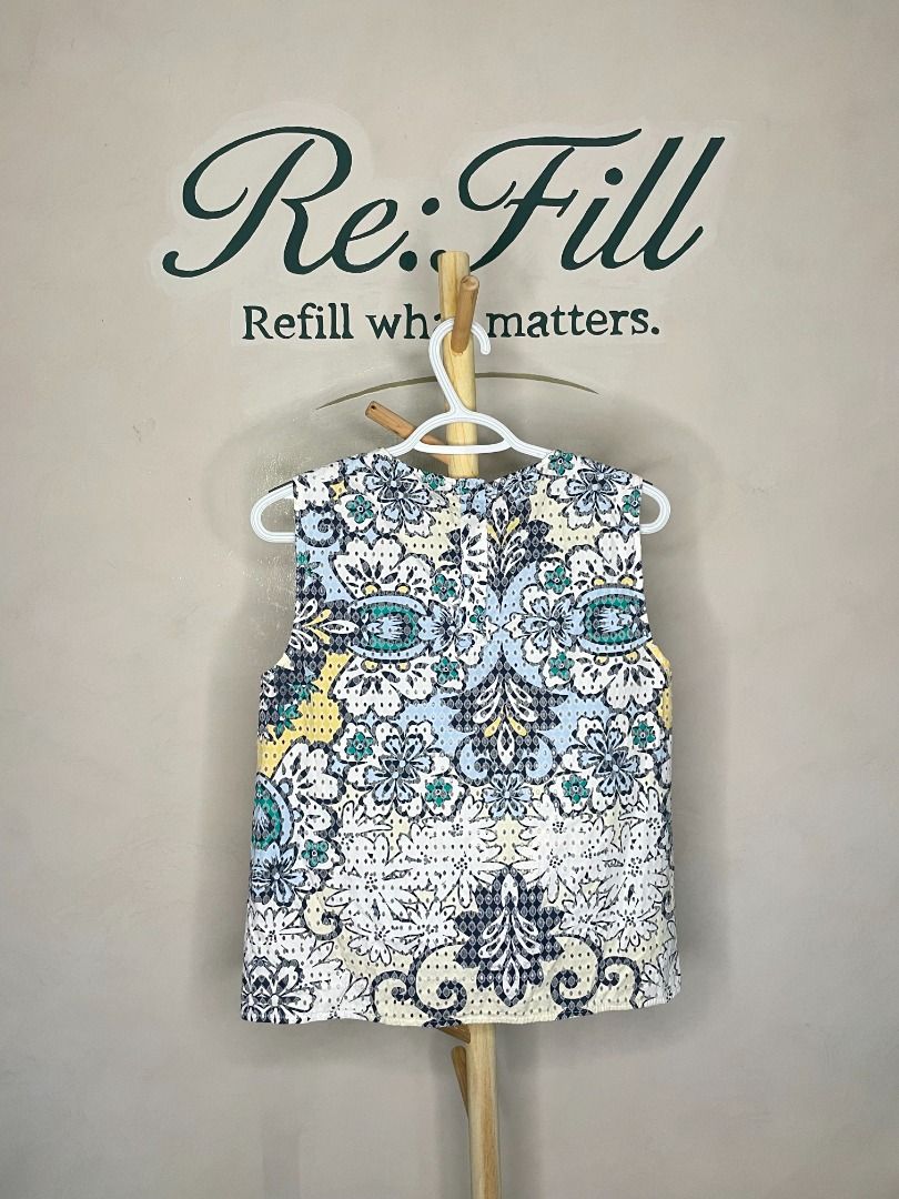 Zara Basic Sleeveless Patterned Top Size S (Category: Sleeveless) located in Taguig. Submitted by re.wear.mnl (Listing ID 1468004183, Image 2). Description: - Brand: Zara Basic - Size: S - Material: 100% Cotton - Design: Eyelet perforated texture with multi-color blue, yellow, and black floral pattern - Neckline: Round neckline - Features: Lightweight, sleeveless, made in Spain - Condition: Excellent pre-loved / Brand new (ready to wear).