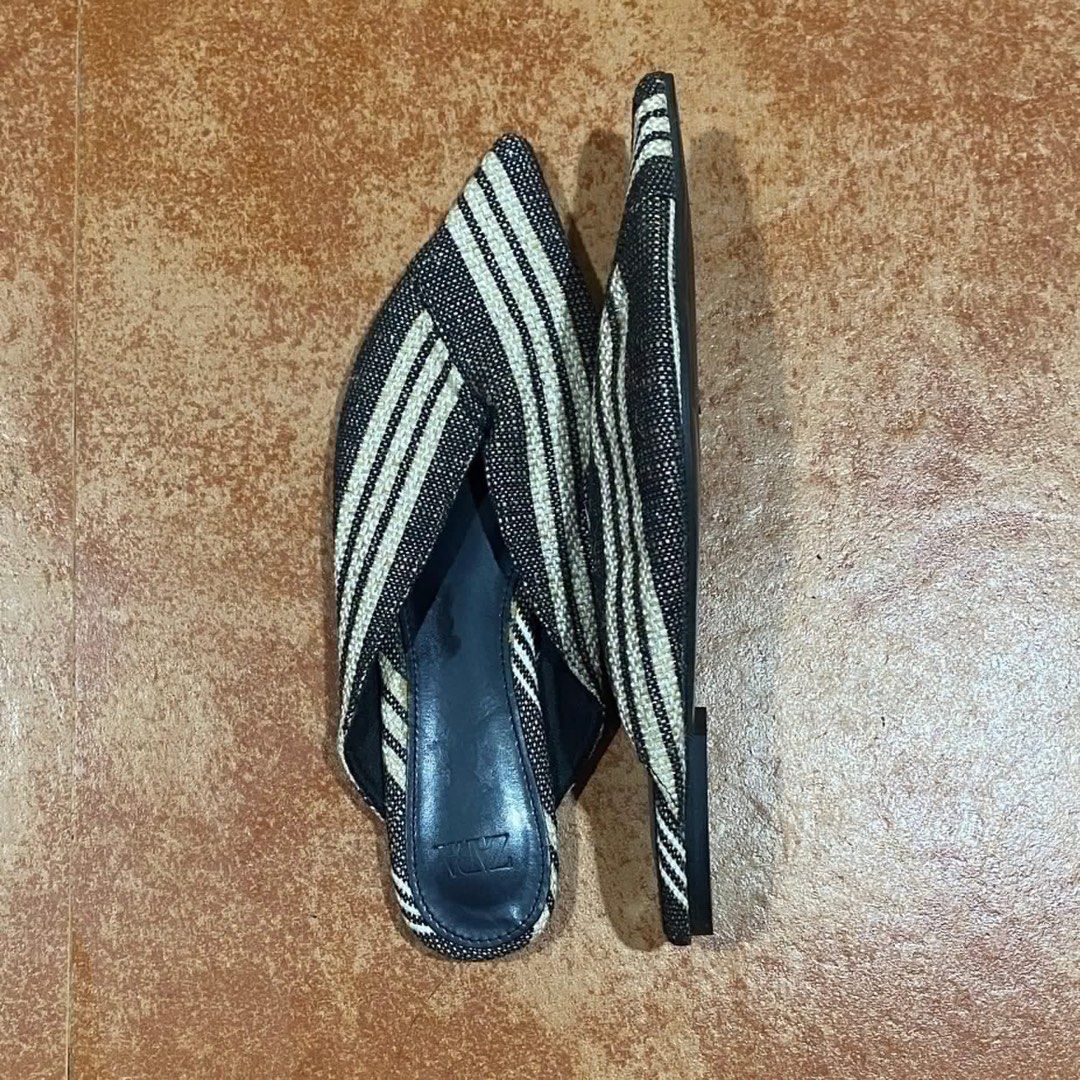 Zara Black and White Striped Pointed Toe Mules (Category: Flats & Sandals) located in Malita. Submitted by happy_duckling (Listing ID 1467846940, Image 2). Description: - Brand: Zara - Style: Pointed toe mules with slip-on flat design and crossover strap detail - Color/Pattern: Black and white striped fabric - Size: 37 (based on sole marking) - Condition: Excellent, very clean outsoles with hardly any wear.