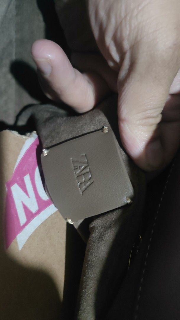 ZARA Brown Shoulder Bag with Resin Bead Strap (Category: Shoulder Bags) located in Caloocan City. Submitted by joshuadyogi0122 (Listing ID 1467844494, Image 2). Description: - Brand: ZARA - Color: Brown - Shape: Trendy semi-circle with flap closure - Strap: Adjustable strap detailed with tortoiseshell resin beads - Interior: Clean lining with official INDITEX group branding and style reference tag - Capacity: Compact yet roomy enough for daily es