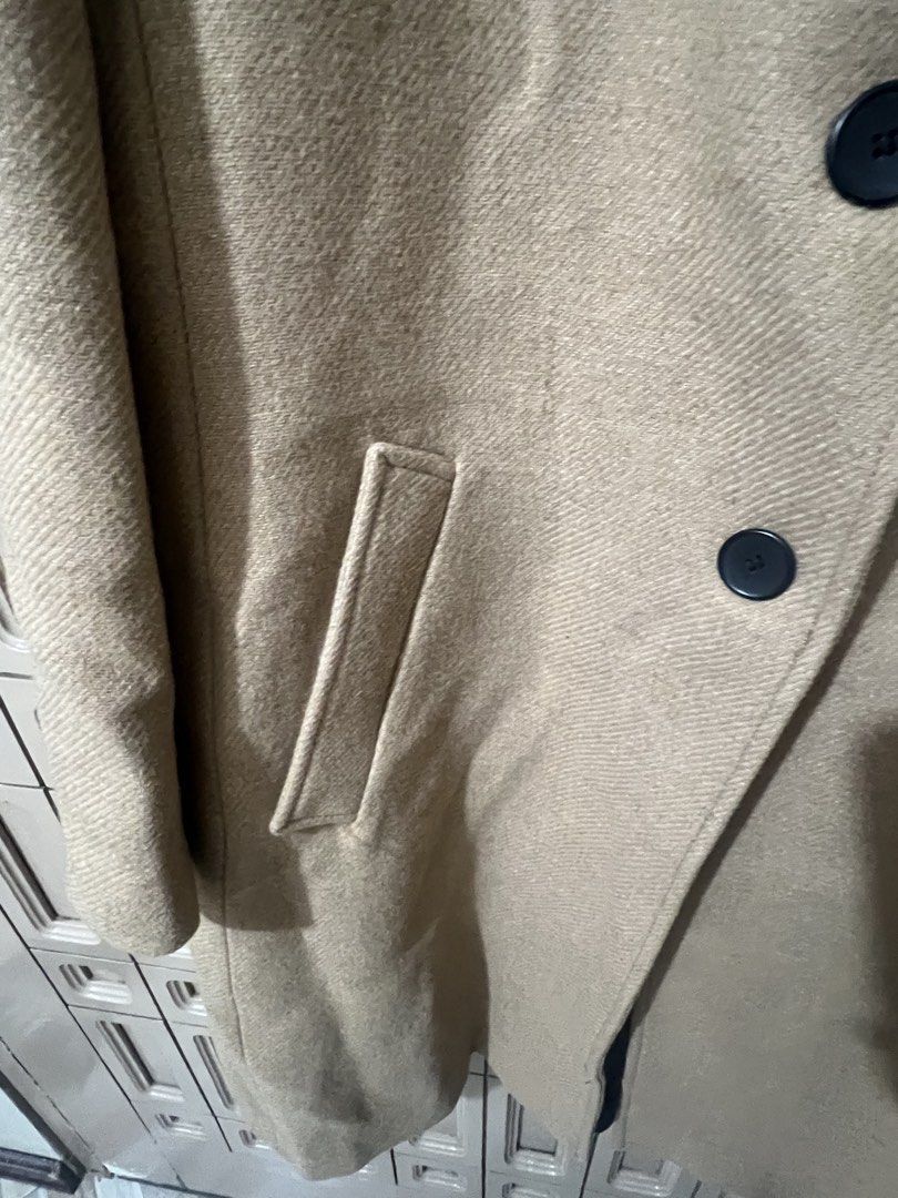 Zara Camel Long Wool Coat Size XL (Category: Coats, Jackets and Outerwear) located in Pasay City. Submitted by sharshay317 (Listing ID 1468056455, Image 3). Description: Zara camel long coat in size XL. Classic lapel collar with front button closure. Two functional front welt pockets. Matching buttons on sleeve cuffs. Neutral beige herringbone texture fabric. Timeless winter outerwear piece. Warm, thick material. Clean interior lining. Bought thi