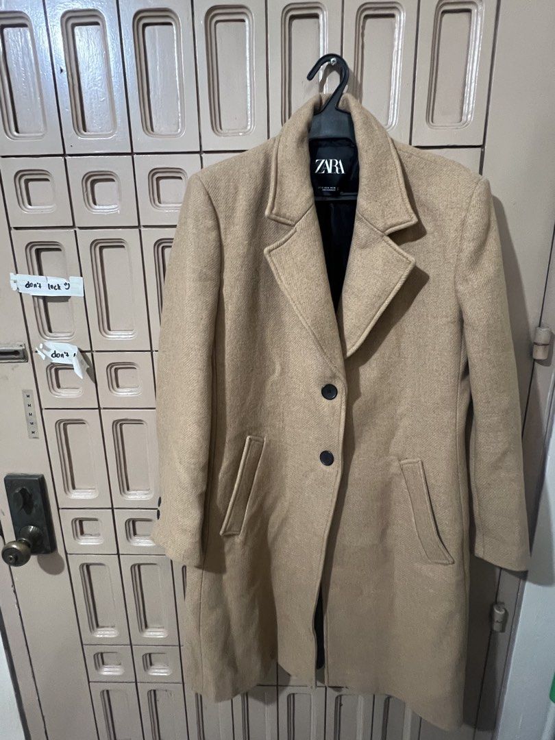 Zara Camel Long Wool Coat Size XL (Category: Coats, Jackets and Outerwear) located in Pasay City. Submitted by sharshay317 (Listing ID 1468056455, Image 1). Description: Zara camel long coat in size XL. Classic lapel collar with front button closure. Two functional front welt pockets. Matching buttons on sleeve cuffs. Neutral beige herringbone texture fabric. Timeless winter outerwear piece. Warm, thick material. Clean interior lining. Bought thi