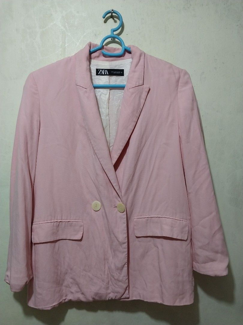 Zara Pink Blazer Jacket Size M (Category: Coats, Jackets and Outerwear) located in Manila. Submitted by PrinceDani.Clothing (Listing ID 1467965778, Image 2). Description: - Brand: Zara - Size: M - Color: Light pink - Material: Comfortable cotton-blend fabric - Design: Double-breasted front with two light buttons - Pockets: Two front patch pockets - Details: Classic lapel collar and chic white patterned lining - Styling: Great layering piece for b