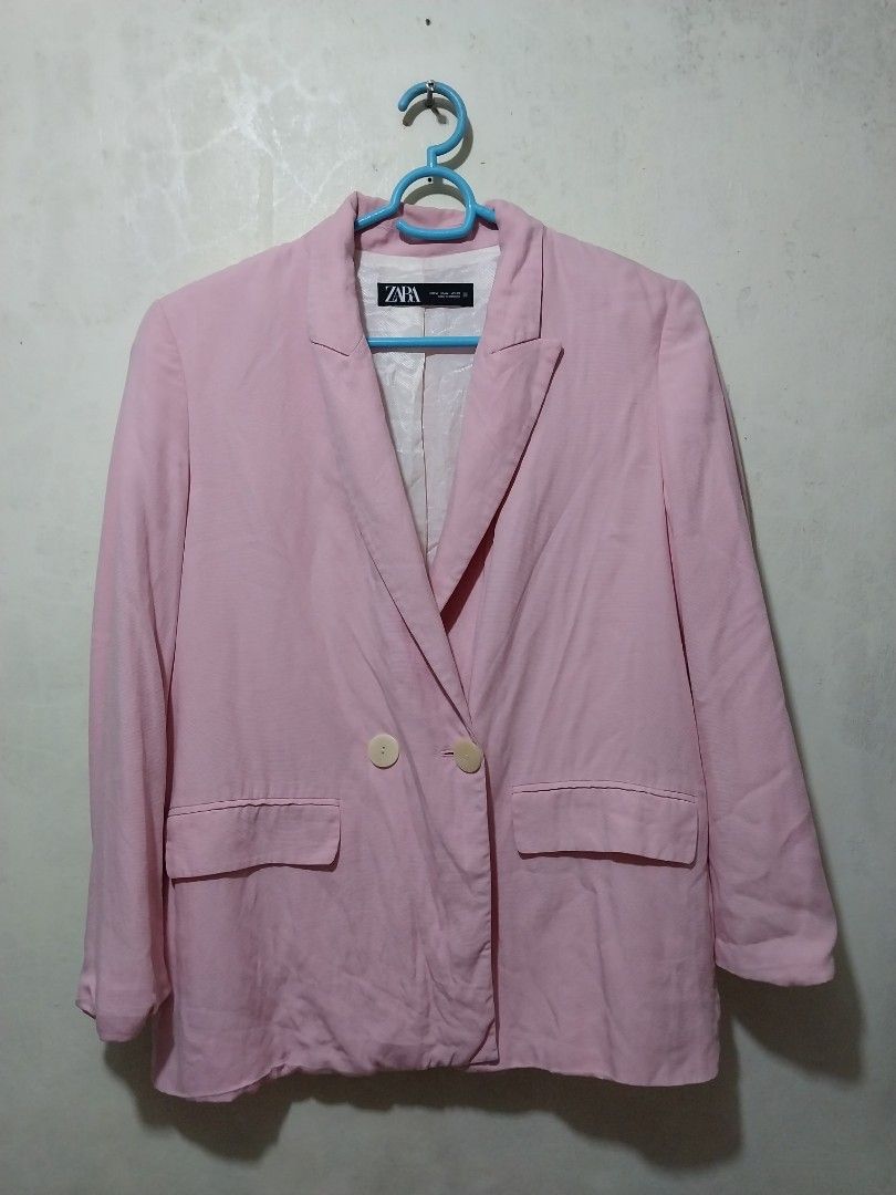 Zara Pink Blazer Jacket Size M (Category: Coats, Jackets and Outerwear) located in Manila. Submitted by PrinceDani.Clothing (Listing ID 1467965778, Image 1). Description: - Brand: Zara - Size: M - Color: Light pink - Material: Comfortable cotton-blend fabric - Design: Double-breasted front with two light buttons - Pockets: Two front patch pockets - Details: Classic lapel collar and chic white patterned lining - Styling: Great layering piece for b