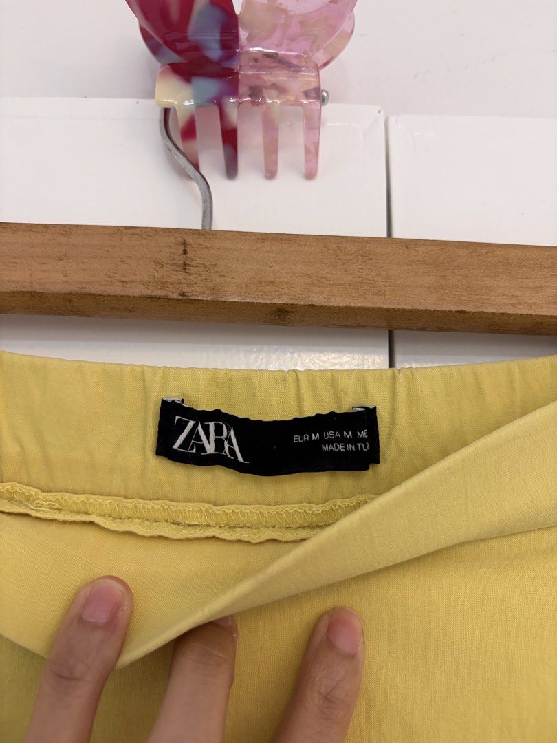 Zara Yellow Ruffle Mini Skort (Category: Skirts) located in Quezon City. Submitted by prelovedbynxkole (Listing ID 1467880445, Image 2). Description: - Brand: Zara - Color: Bright yellow - Size: Medium (true to size) - Style: Dropped waist with flared ruffle hem, with built-in shorts - Closure: Side zip - Condition: Clean, worn a couple of times only ALL CLOTHES NEED TO BE WASHED & IRONED AS THEY HAVE BEEN SITTING IN STORAGE <3 Shipping from QC! 