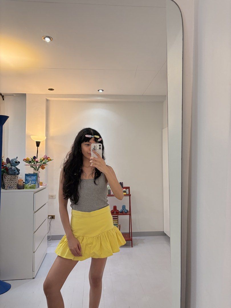 Zara Yellow Ruffle Mini Skort (Category: Skirts) located in Quezon City. Submitted by prelovedbynxkole (Listing ID 1467880445, Image 3). Description: - Brand: Zara - Color: Bright yellow - Size: Medium (true to size) - Style: Dropped waist with flared ruffle hem, with built-in shorts - Closure: Side zip - Condition: Clean, worn a couple of times only ALL CLOTHES NEED TO BE WASHED & IRONED AS THEY HAVE BEEN SITTING IN STORAGE <3 Shipping from QC! 