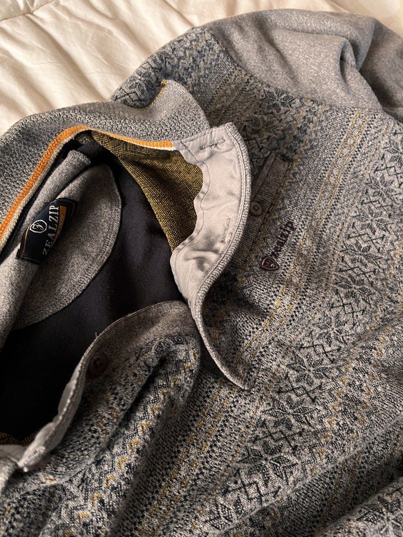 Zealzip Grey Patterned Quarter Button Sweater Size L (Category: Coats, Jackets and Outerwear) located in Manila. Submitted by miyu.ga (Listing ID 1467919717, Image 3). Description: - Brand: Zealzip - Color: Grey with intricate Nordic knit pattern - Size: Large - Details: Quarter button closure, foldover collar, subtle orange piping on inner collar - Fit: Ribbed cuffs and hem for a snug fit - Condition: Great cold weather staple.