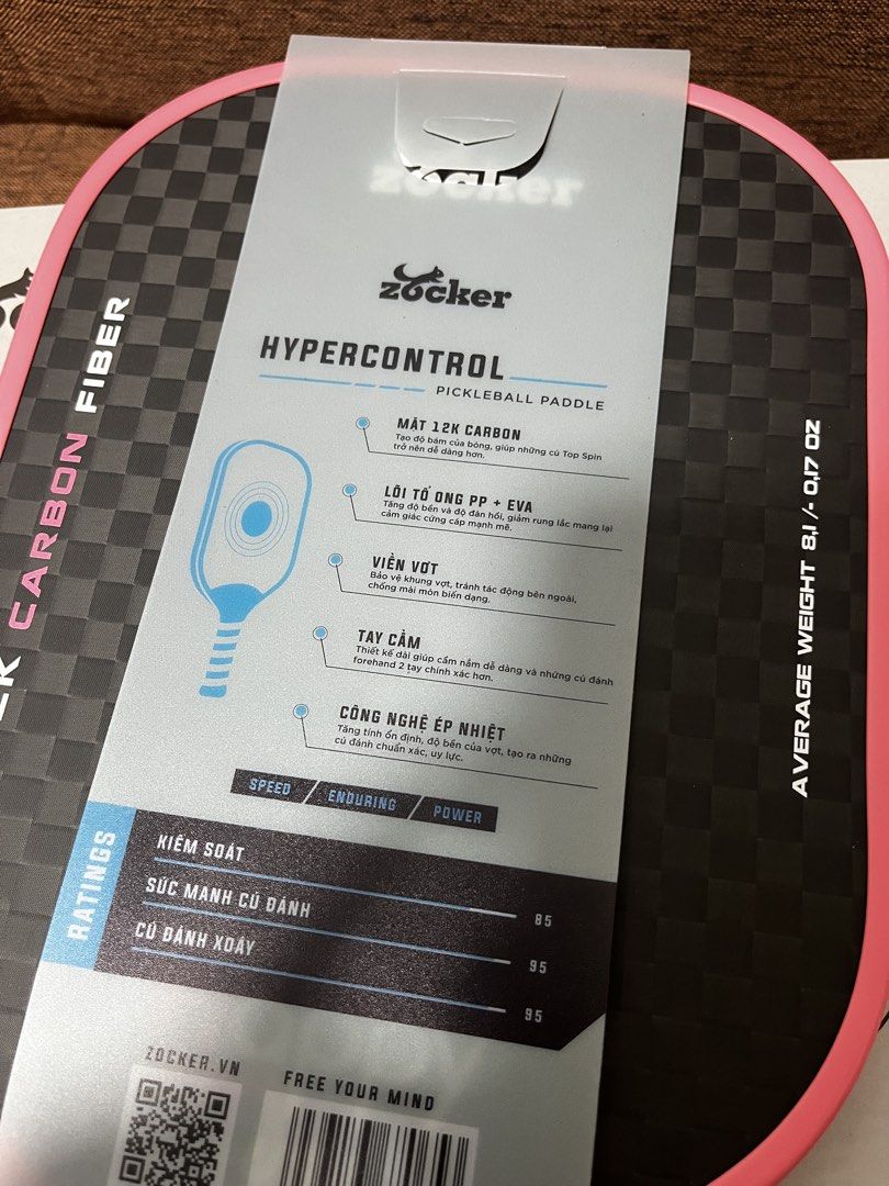Zocker Happy Hypercontrol 12K Carbon Fiber Pickleball Paddle (Category: Racket and Ball Sports) located in Manila. Submitted by thefootyhub (Listing ID 1467919007, Image 3). Description: NEGOTIABLE Zocker Happy Hypercontrol pickleball paddle. 12K carbon fiber face, power 16mm thickness, PP and EVA honeycomb core. Average weight around 8.1 oz. Pink trim with white perforated grip tape featuring printed brand logos. Includes original box..