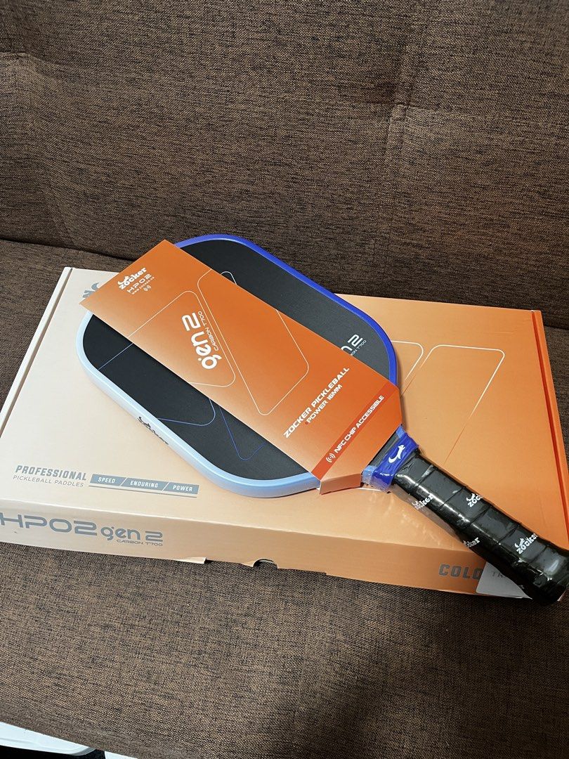 Zocker HPO2 Gen 2 Hypercontrol Power 16mm Pickleball Paddle (Category: Racket and Ball Sports) located in Manila. Submitted by thefootyhub (Listing ID 1467920190, Image 1). Description: - Brand new in original box with tags attached - Model: Zocker HPO2 Gen 2 Power (16mm) - Surface: Premium T700 Raw Carbon for maximum spin and control - Core: High-density PP honeycomb core for enhanced power - Tech: Built-in NFC chip accessible - Design: Eye-catc