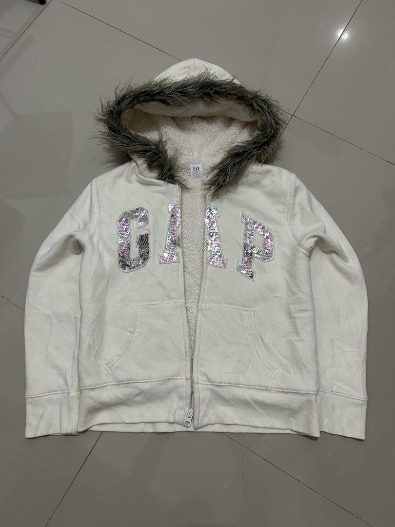 00s archive GAP fur sequin zip hoodie (Category: Coats, Jackets and Outerwear) located in Quezon City. Submitted by commonwealthpickerph (Listing ID 1468073816, Image 1). Description: 00s archive GAP fur sequin zip hoodie - 16 width // length 19.5 - in good condition - Has sign of used - No major issues - minor lints - need wash - Warm and fuzzy sherpa lining with cozy faux fur trim on the hood - Eye-catching large GAP logo in shiny pink and silv