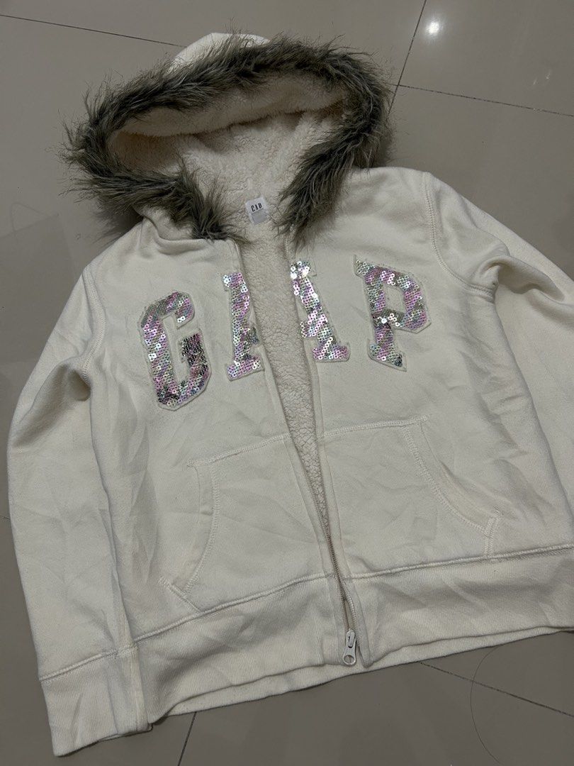 00s archive GAP fur sequin zip hoodie (Category: Coats, Jackets and Outerwear) located in Quezon City. Submitted by commonwealthpickerph (Listing ID 1468073816, Image 2). Description: 00s archive GAP fur sequin zip hoodie - 16 width // length 19.5 - in good condition - Has sign of used - No major issues - minor lints - need wash - Warm and fuzzy sherpa lining with cozy faux fur trim on the hood - Eye-catching large GAP logo in shiny pink and silv
